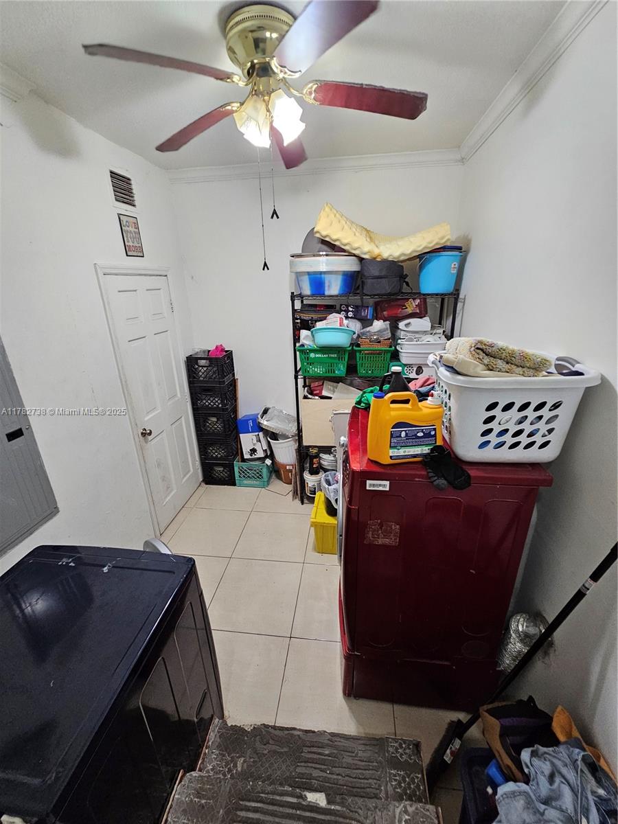 Westview Miami, FL 33167 - Photo 39 of 46 a living room with furniture and a flat screen tv