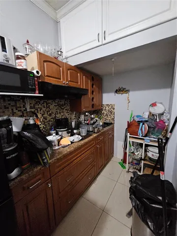 a kitchen with a stove and cabinets
