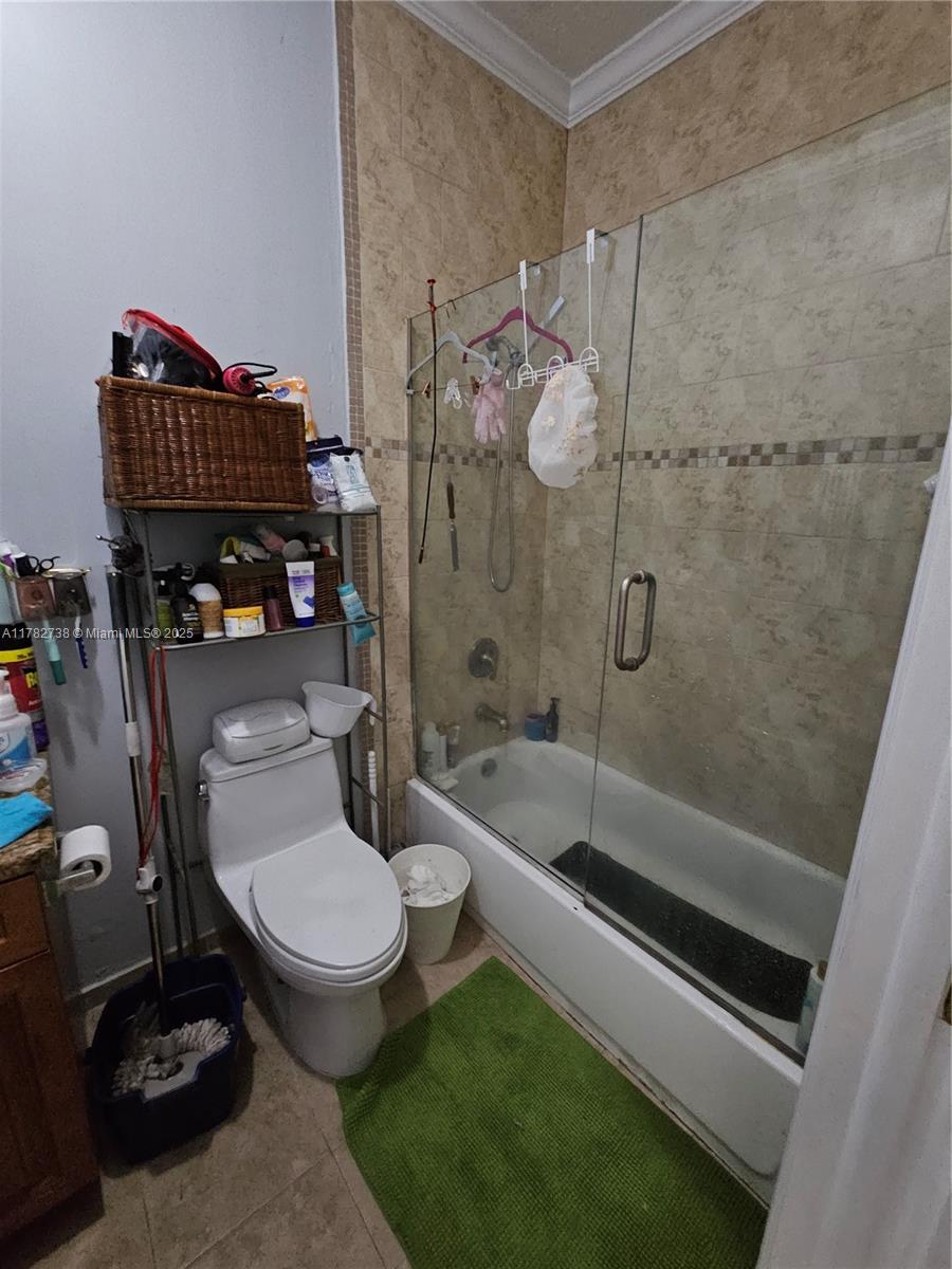 Westview Miami, FL 33167 - Photo 42 of 46 a bathroom with a granite countertop toilet sink and shower