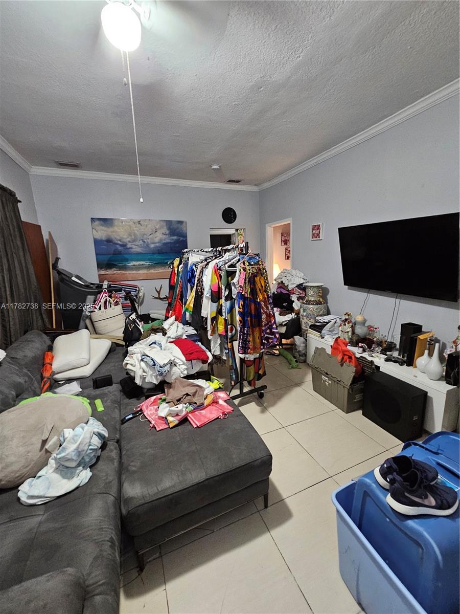 Westview Miami, FL 33167 - Photo 45 of 46 a room with storage and a flat screen tv