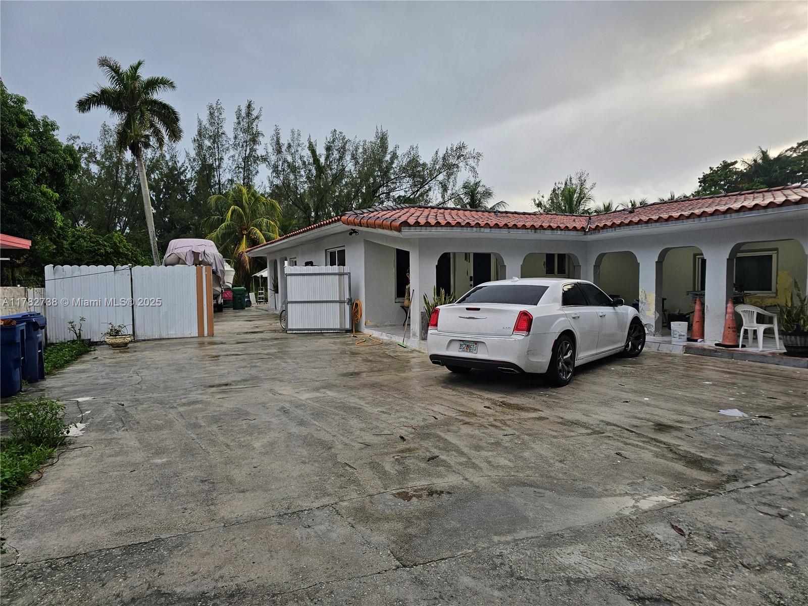 Westview Miami, FL 33167 - Photo 5 of 46 a view of a cars park in front of a house