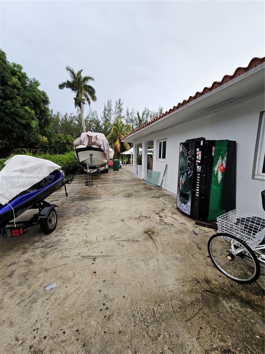 Westview Miami, FL 33167 - Photo 6 of 46 a car parked in front of white house