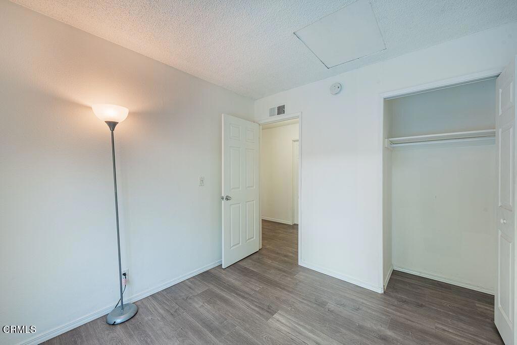 2250 North Goddard Avenue Simi Valley, CA 93063 - Photo 14 of 25 a view of an empty room with wooden floor