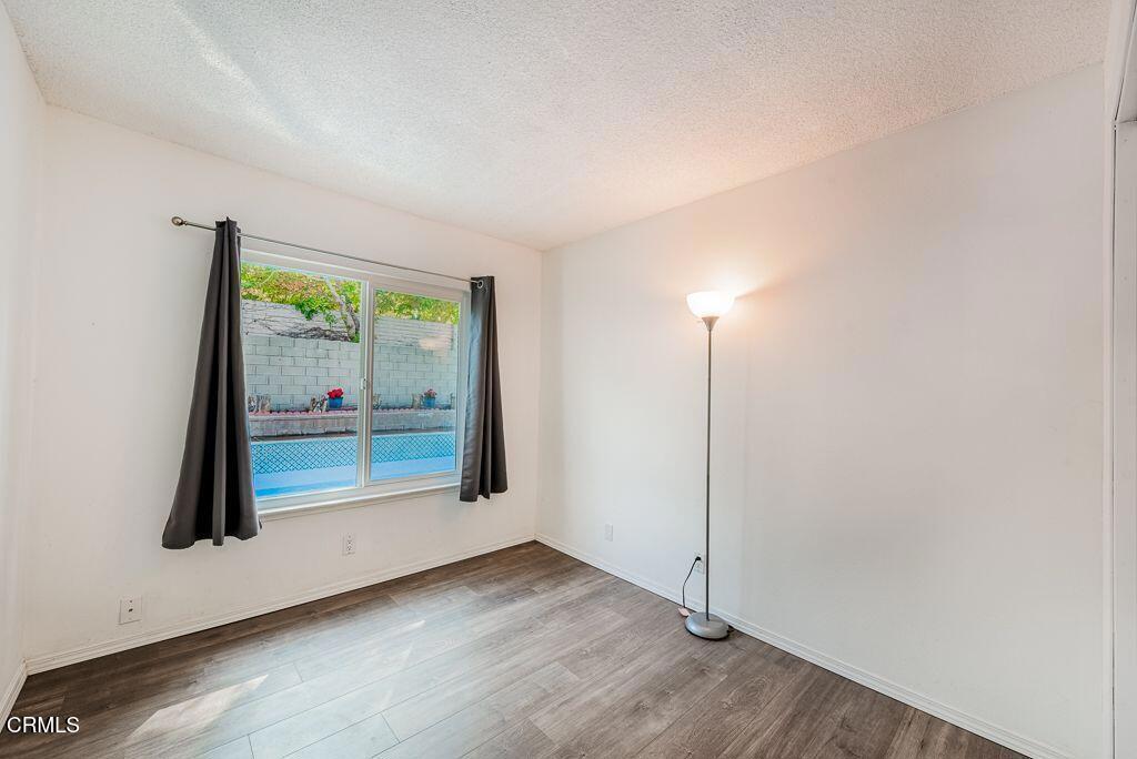 2250 North Goddard Avenue Simi Valley, CA 93063 - Photo 17 of 25 wooden floor in an empty room with a window