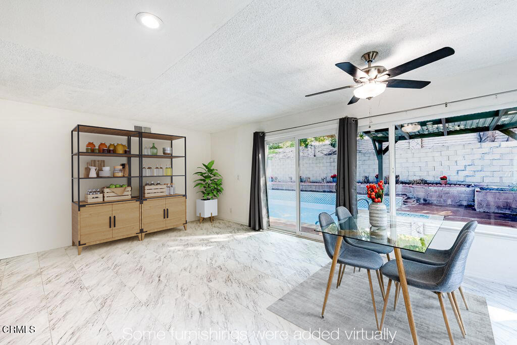 2250 North Goddard Avenue Simi Valley, CA 93063 - Photo 9 of 25 a view of a workspace with furniture and a kitchen