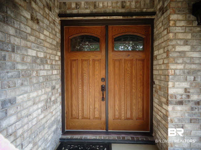 2804 Pine Ridge Drive Lillian, AL 36549 - Photo 5 of 39 Beautiful front double wood doors with etched glass. Brick exterior. Metal storm panels for for door.