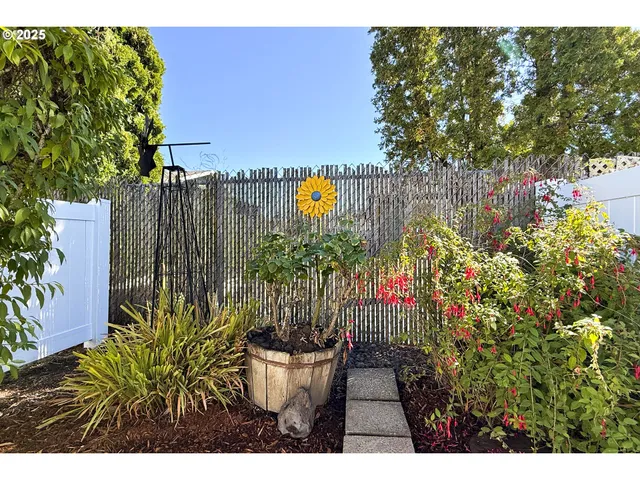 a view of a back yard of the house and a garden