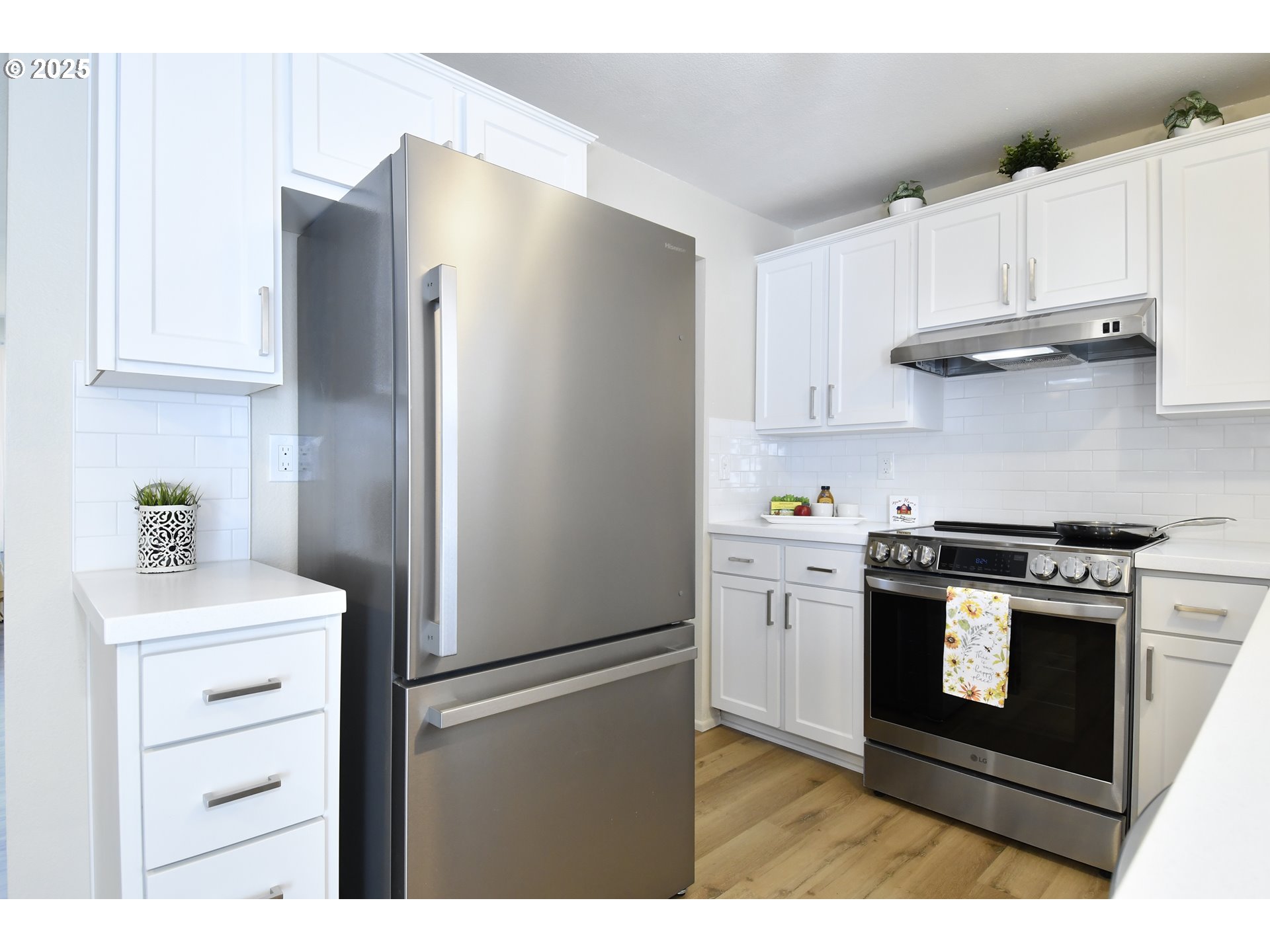 626 Northeast Fleming Avenue, Unit B63 Gresham, OR 97030 - Photo 23 of 45 a kitchen with stainless steel appliances white cabinets and a refrigerator