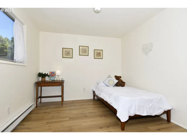 a bedroom with a bed and a table