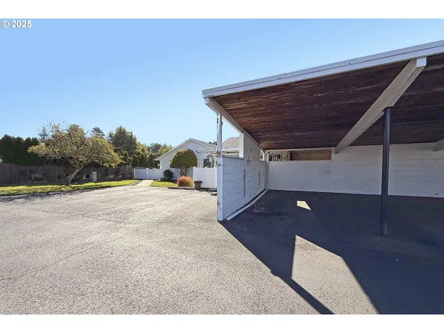a house with swimming pool in front of it