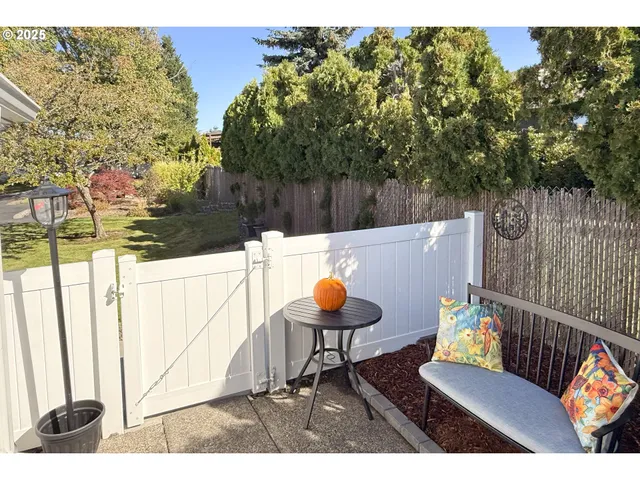 a outdoor sitting area with furniture and wooden floor