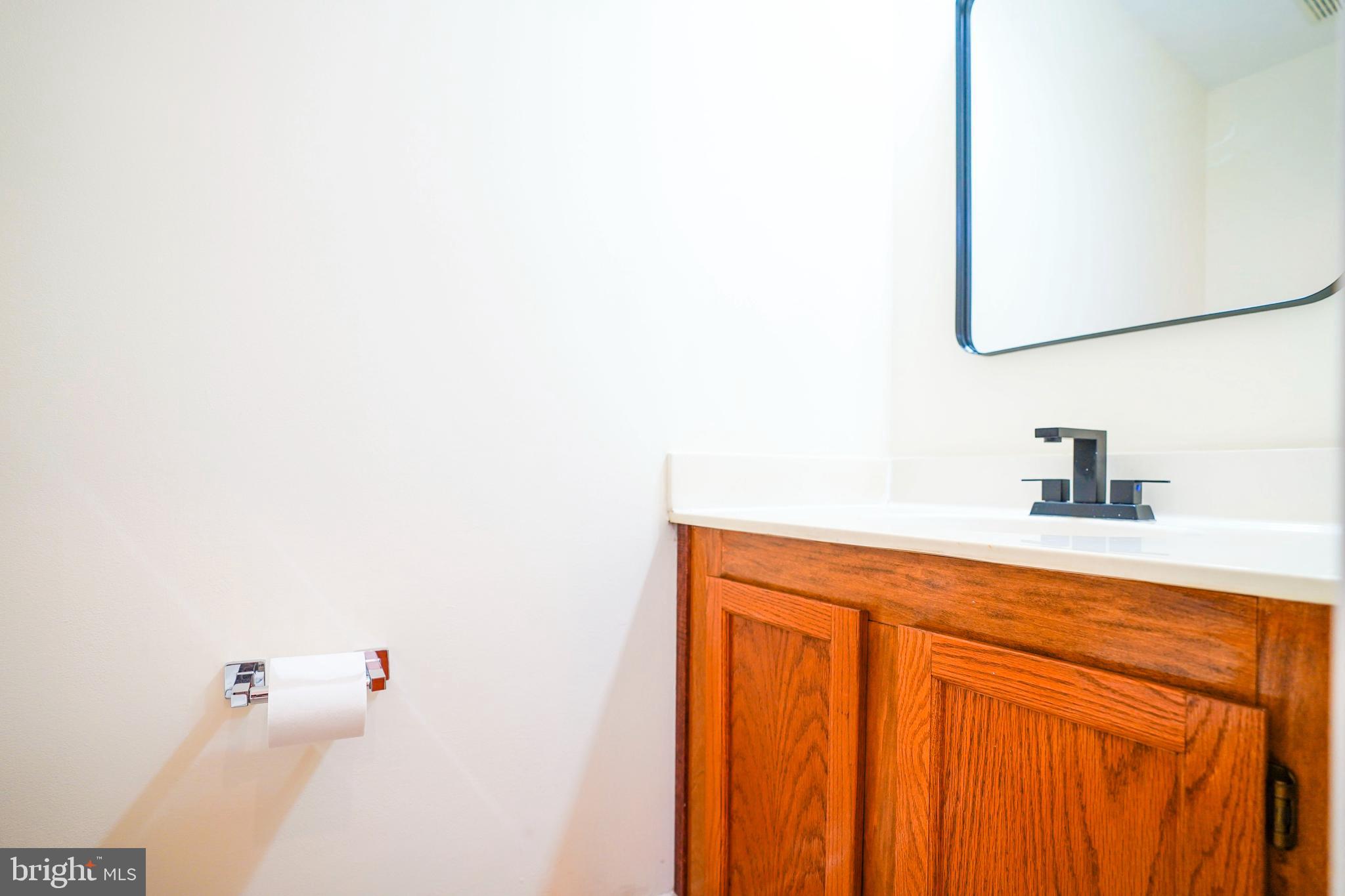 6903 Compton Lane Centreville, VA 20121 - Photo 13 of 35 a bathroom with a sink and a mirror