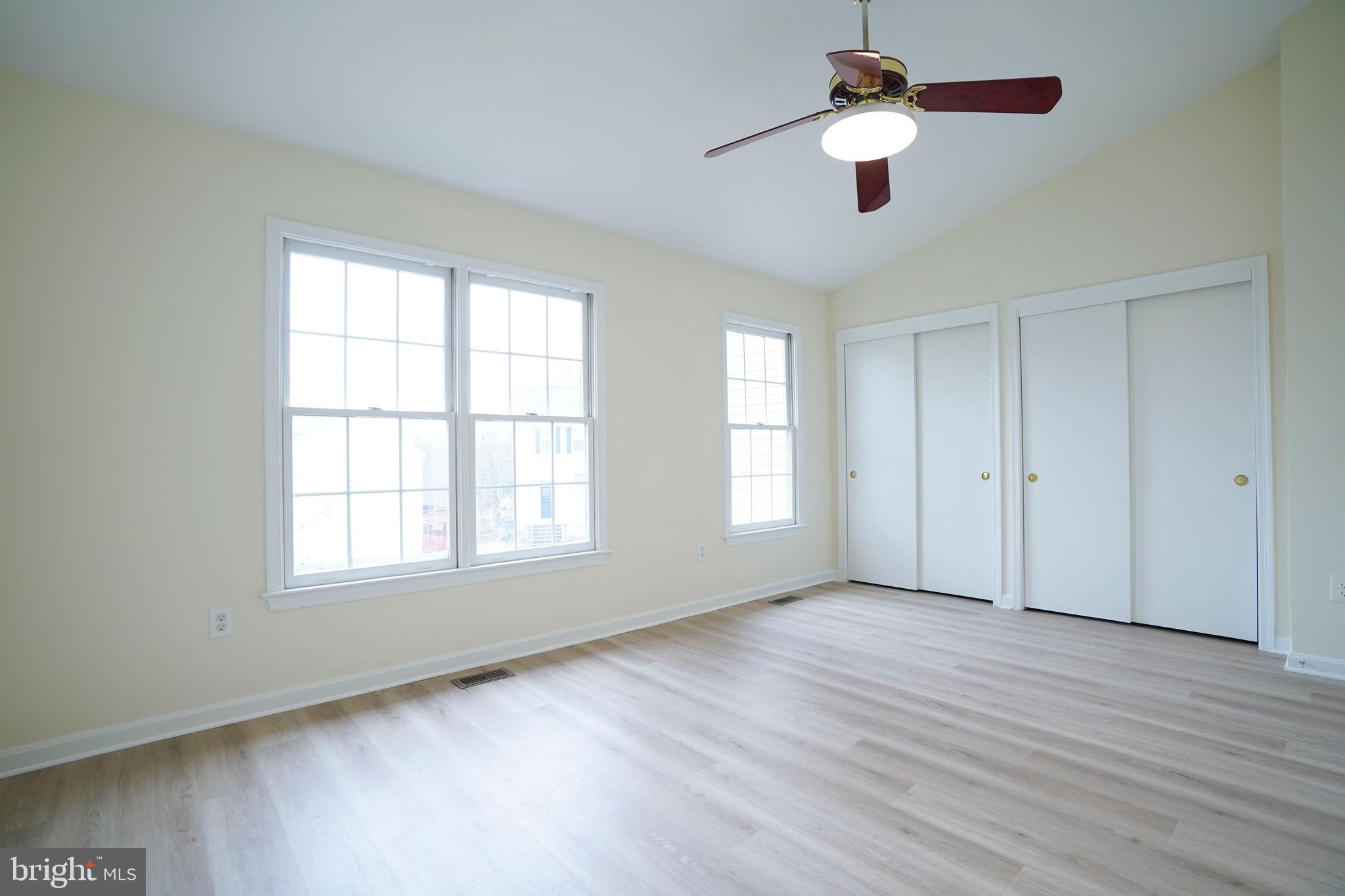 6903 Compton Lane Centreville, VA 20121 - Photo 19 of 35 a view of an empty room with wooden floor and a window