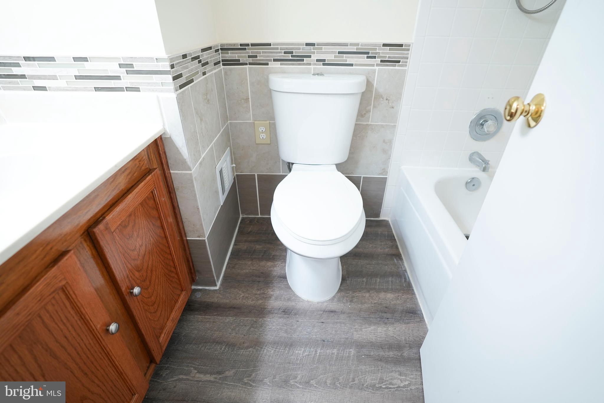 6903 Compton Lane Centreville, VA 20121 - Photo 22 of 35 a bathroom with a toilet and a shower