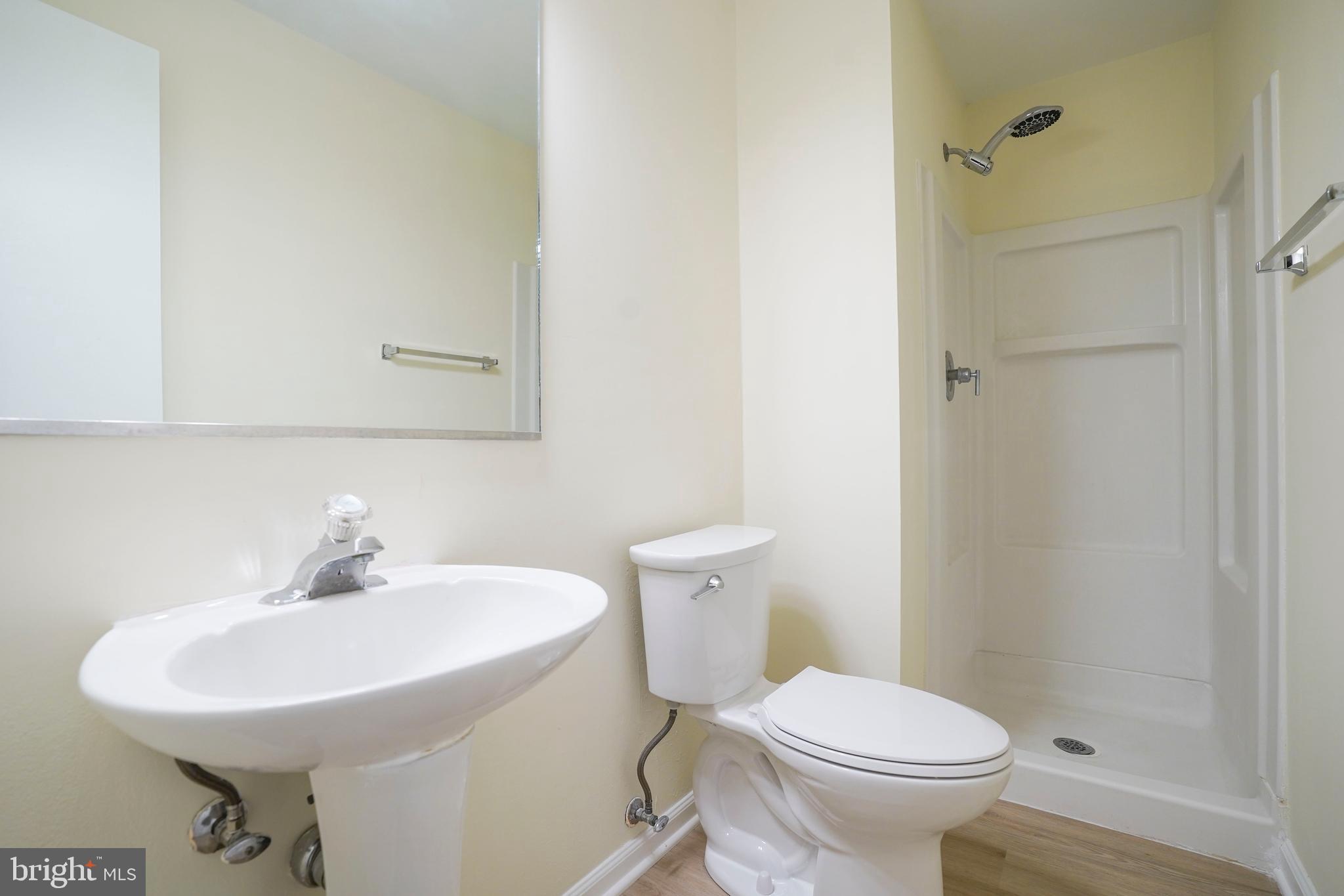 6903 Compton Lane Centreville, VA 20121 - Photo 29 of 35 a bathroom with a sink toilet and a mirror