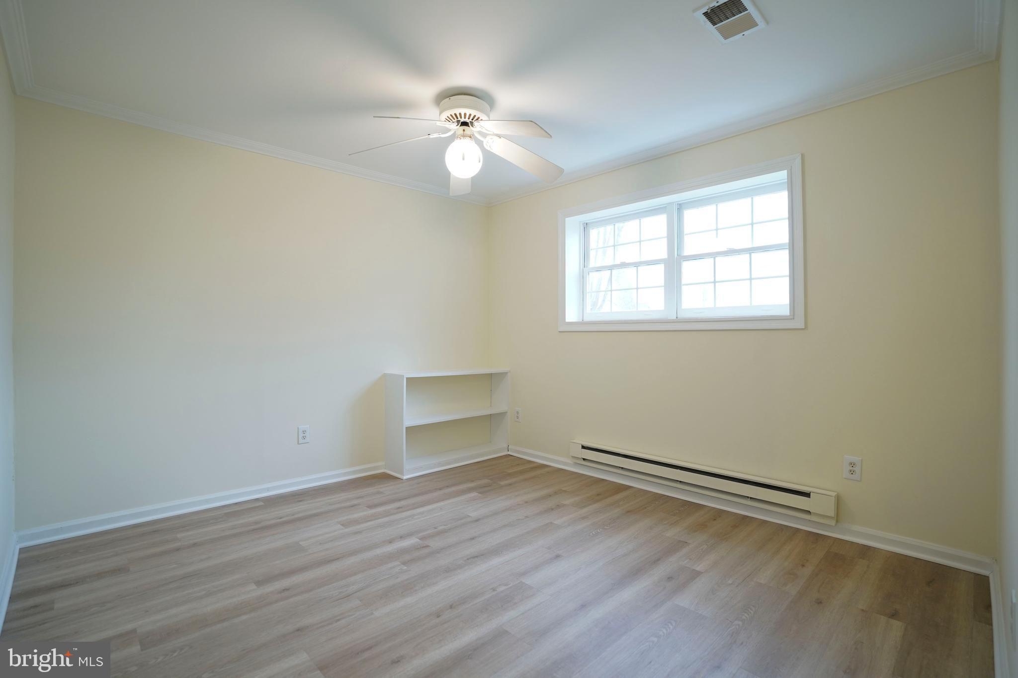 6903 Compton Lane Centreville, VA 20121 - Photo 30 of 35 an empty room with wooden floor and windows