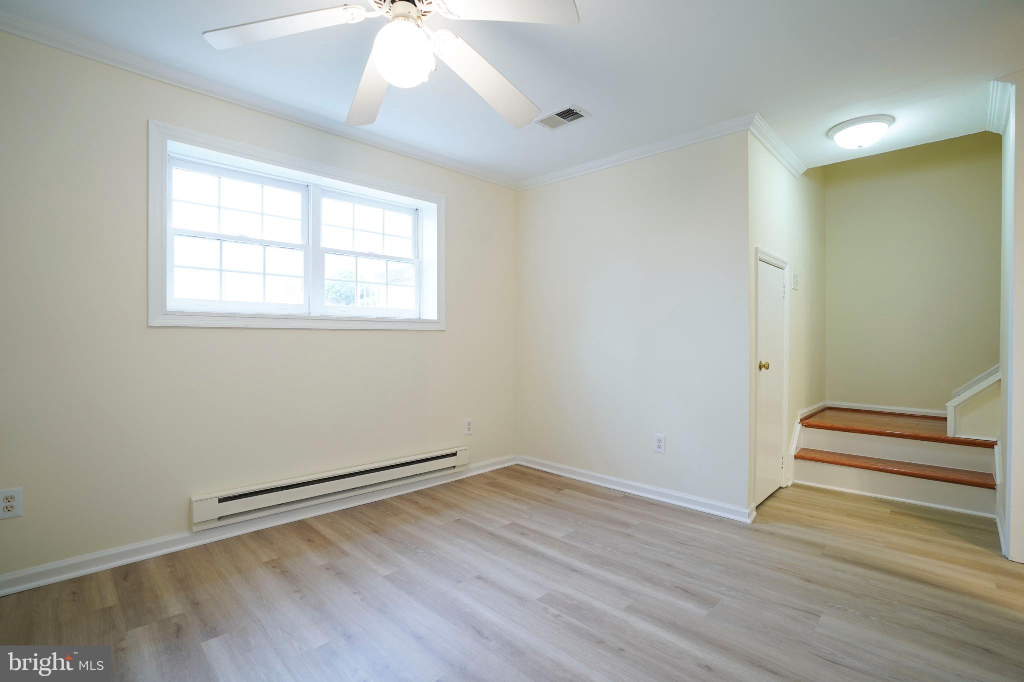 6903 Compton Lane Centreville, VA 20121 - Photo 31 of 35 an empty room with wooden floor and windows
