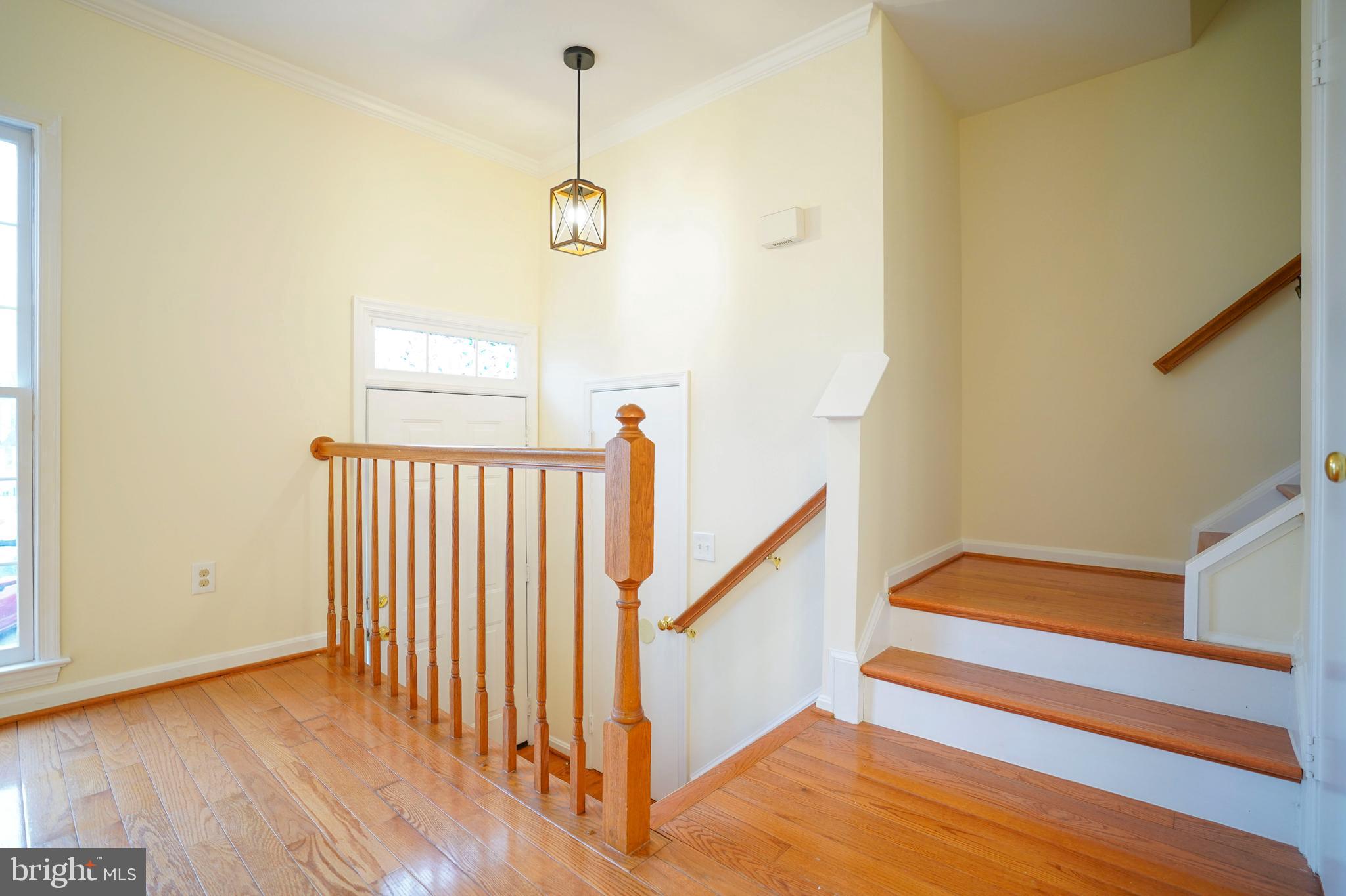 6903 Compton Lane Centreville, VA 20121 - Photo 5 of 35 a view of a room with wooden floor and stairs