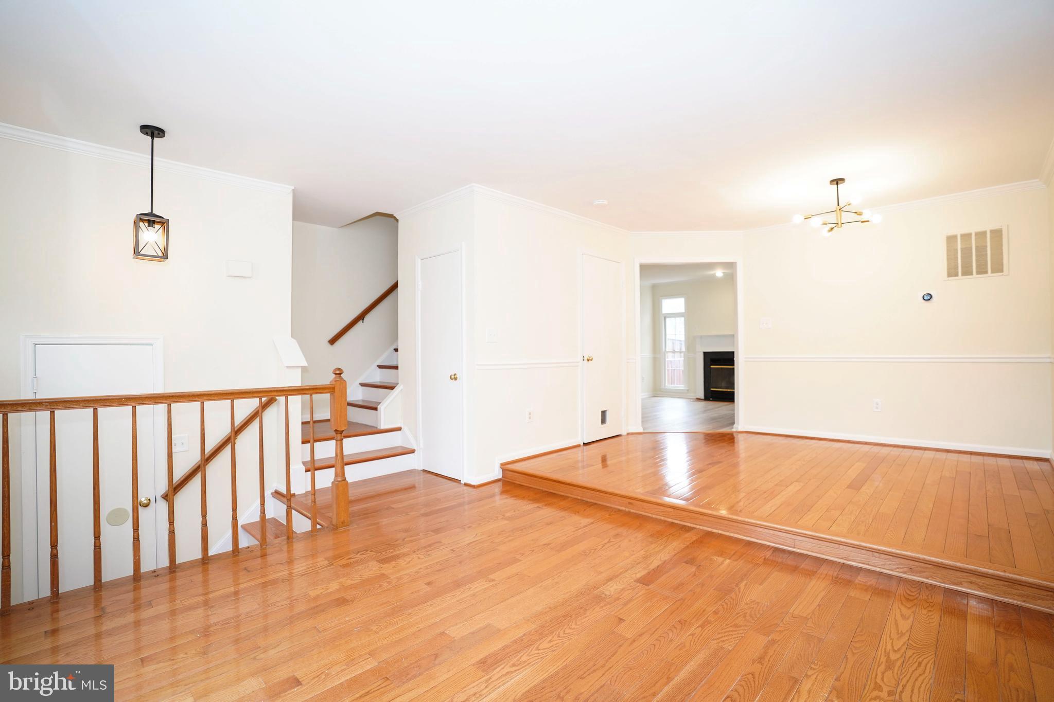 6903 Compton Lane Centreville, VA 20121 - Photo 6 of 35 a view of empty room with wooden floor and fan