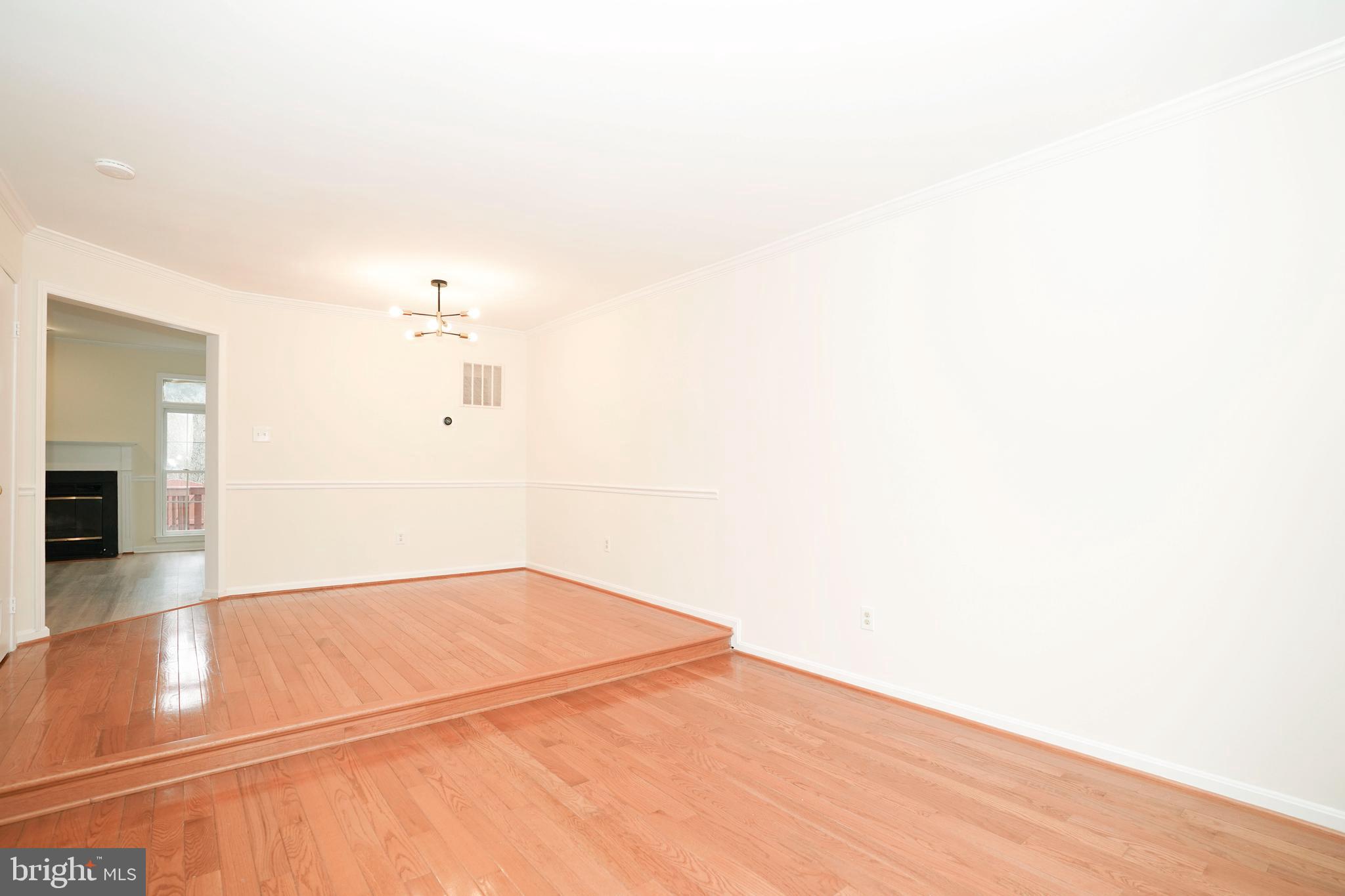 6903 Compton Lane Centreville, VA 20121 - Photo 7 of 35 a view of a kitchen with an empty room