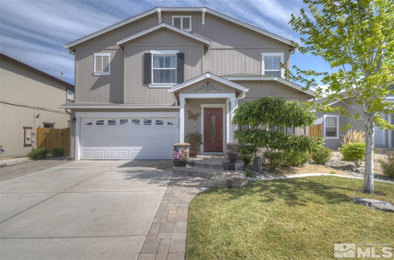 7638 Corso Street Reno, NV 89506 - Photo 1 of 29 a front view of a house with garden