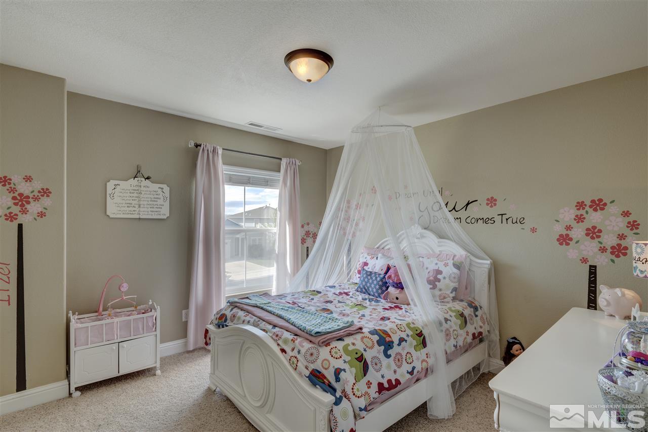 7638 Corso Street Reno, NV 89506 - Photo 15 of 29 a bedroom with bed and a window