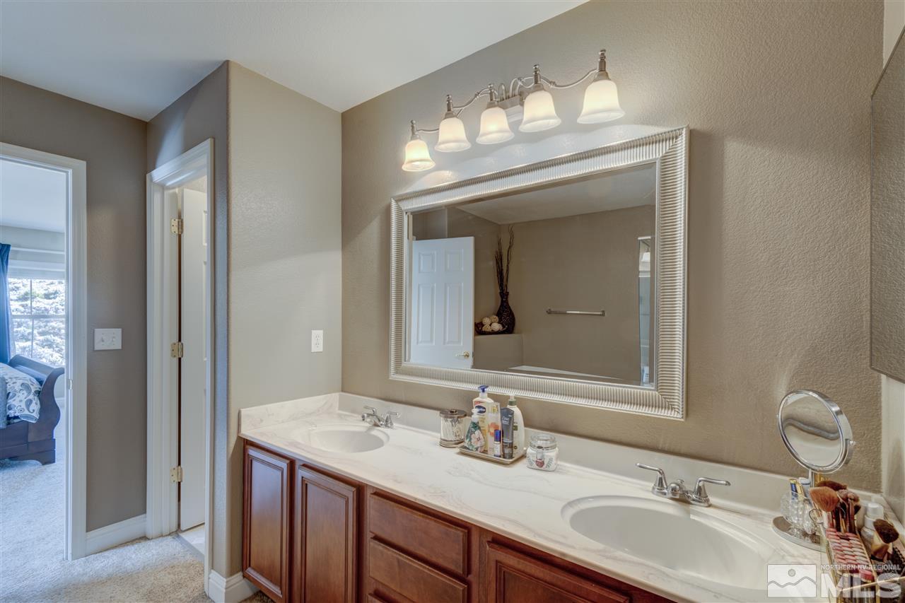 7638 Corso Street Reno, NV 89506 - Photo 17 of 29 a bathroom with a sink and a mirror