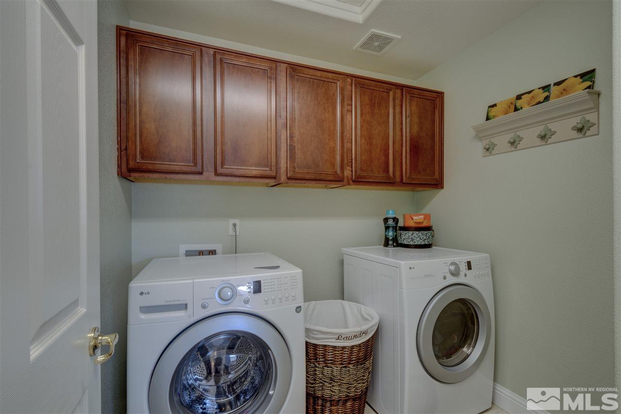 7638 Corso Street Reno, NV 89506 - Photo 20 of 29 a utility room with sink dryer and washer