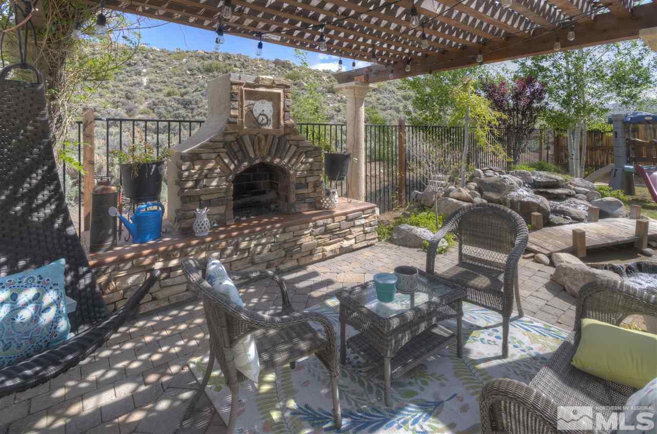 7638 Corso Street Reno, NV 89506 - Photo 23 of 29 a view of a patio with couches table and chairs and potted plants