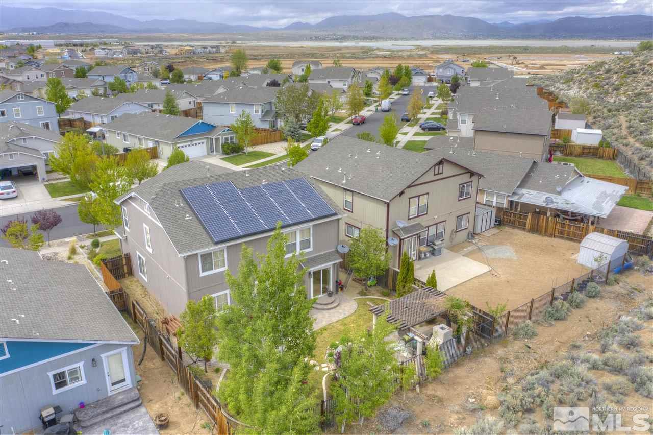 7638 Corso Street Reno, NV 89506 - Photo 3 of 29 an aerial view of residential houses with outdoor space and ocean view