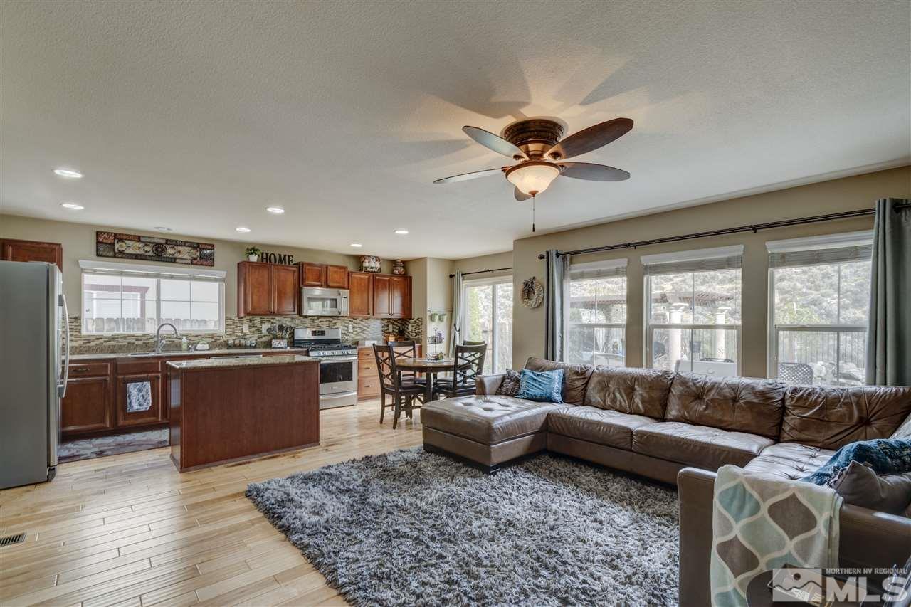 7638 Corso Street Reno, NV 89506 - Photo 4 of 29 a living room with furniture kitchen view and a large window