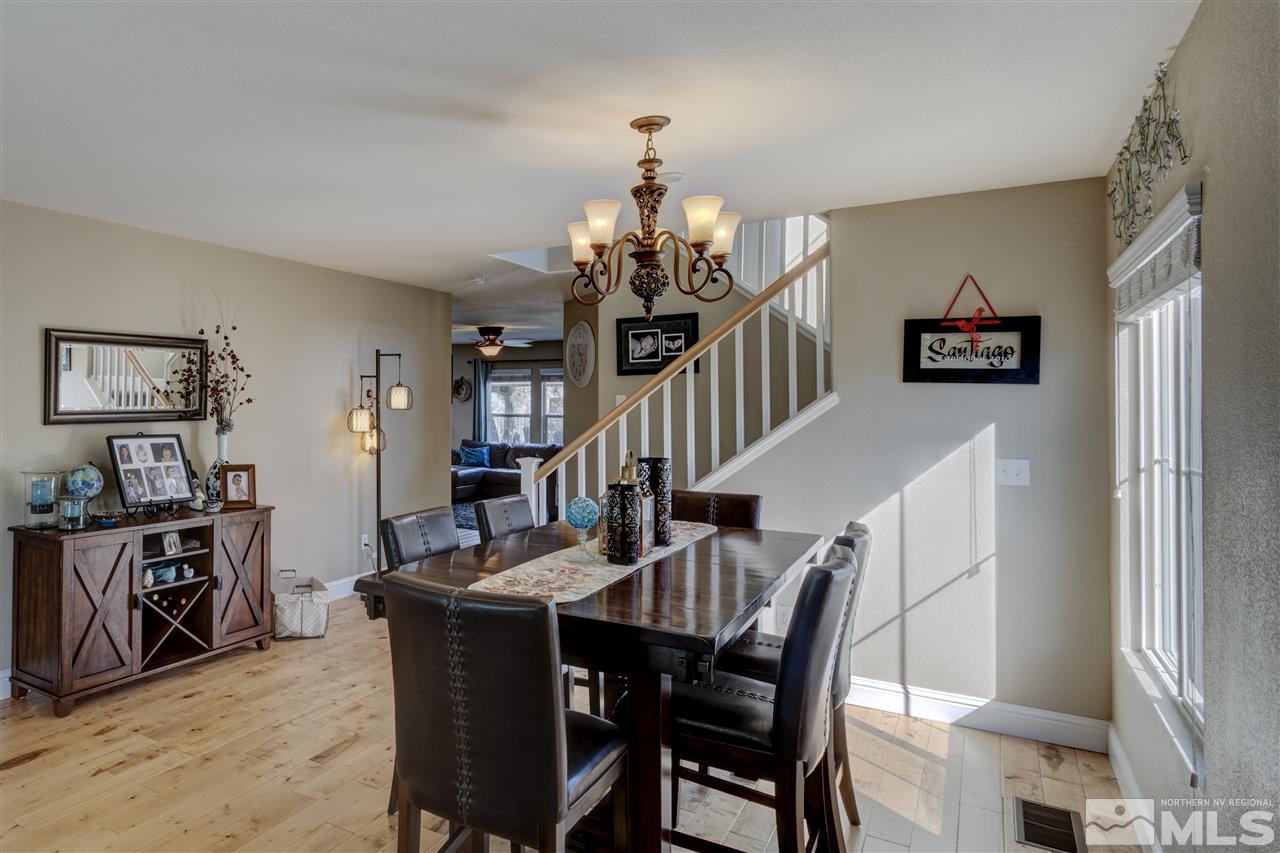 7638 Corso Street Reno, NV 89506 - Photo 8 of 29 a view of a dining room with furniture and wooden floor