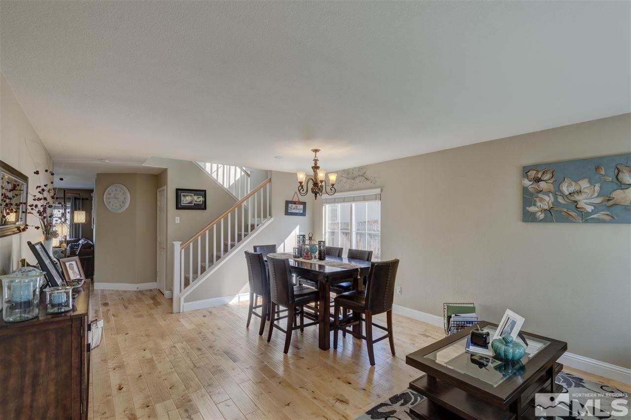 7638 Corso Street Reno, NV 89506 - Photo 9 of 29 a view of a dining room with furniture and wooden floor