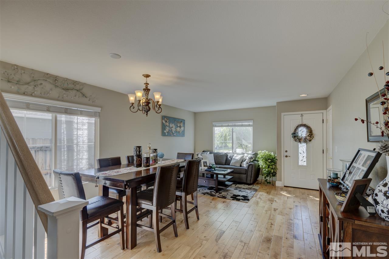 7638 Corso Street Reno, NV 89506 - Photo 10 of 29 a view of a dining room with furniture and wooden floor