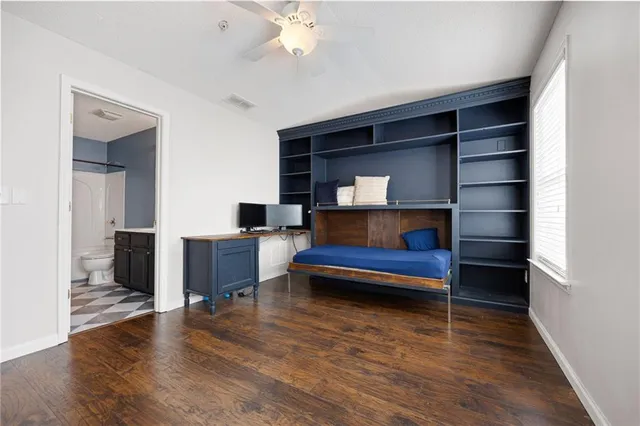 a living room with fireplace furniture and a wooden floor