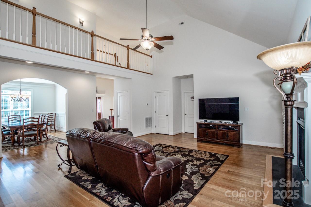 3545 Maple Brook Drive Denver, NC 28037 - Photo 11 of 40 a living room with furniture and a flat screen tv