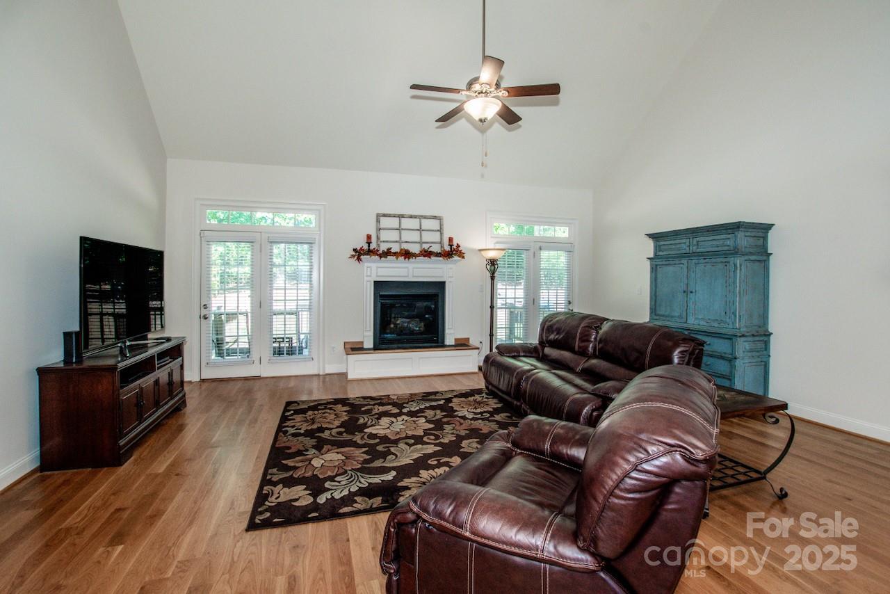 3545 Maple Brook Drive Denver, NC 28037 - Photo 13 of 40 a living room with furniture and a fireplace