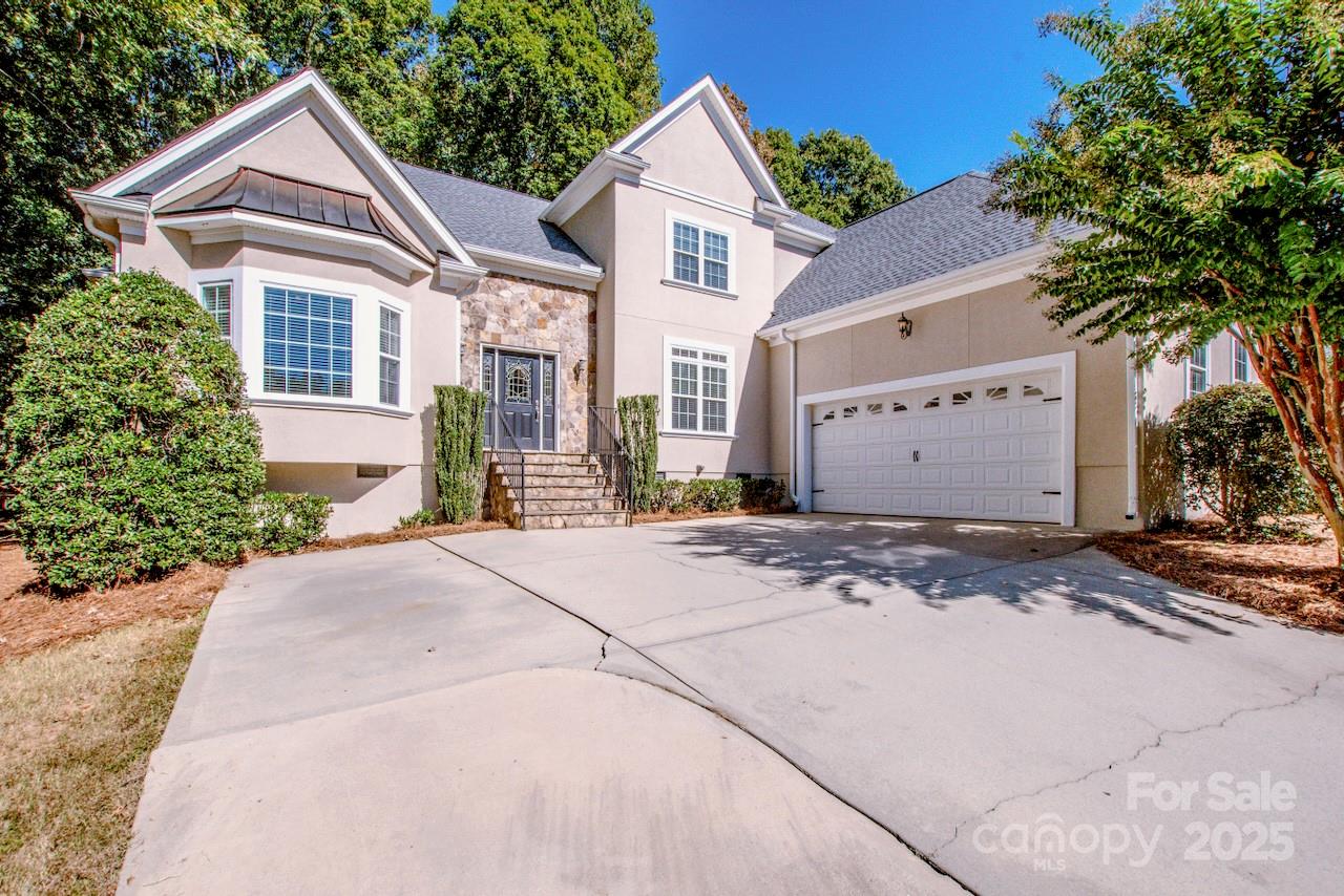 3545 Maple Brook Drive Denver, NC 28037 - Photo 2 of 40 a front view of a house with a yard and garage