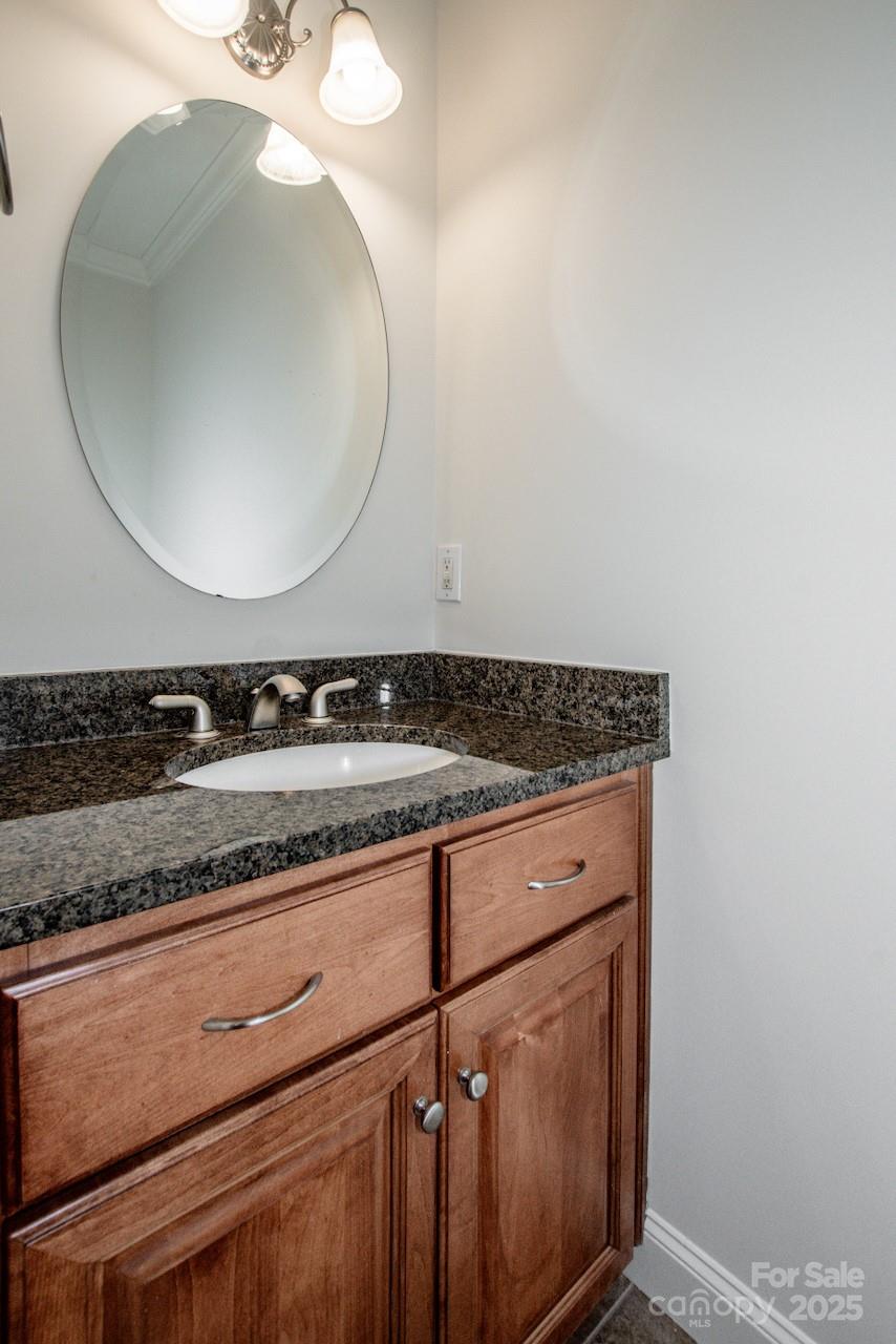 3545 Maple Brook Drive Denver, NC 28037 - Photo 23 of 40 a bathroom with a granite countertop sink and a mirror