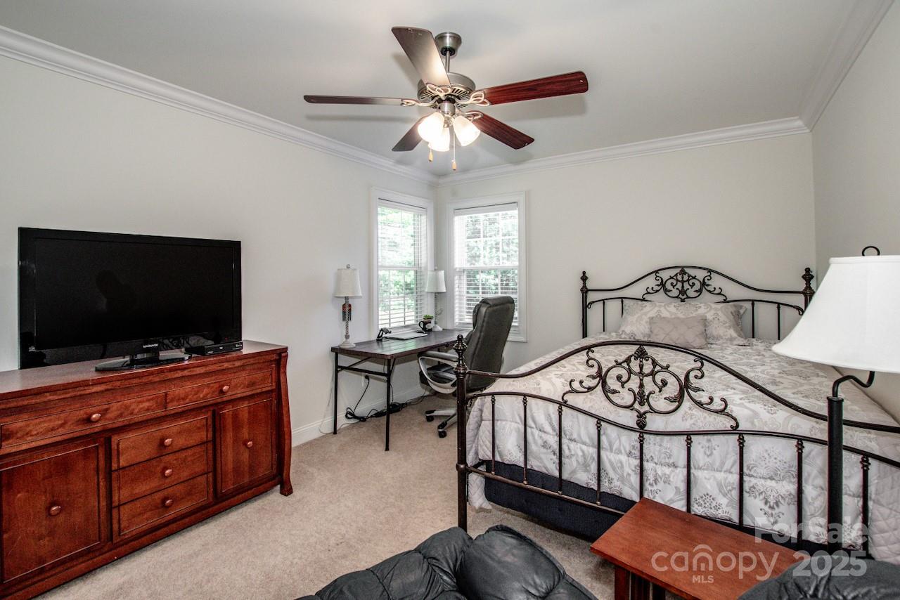 3545 Maple Brook Drive Denver, NC 28037 - Photo 29 of 40 a bedroom with furniture and a flat screen tv