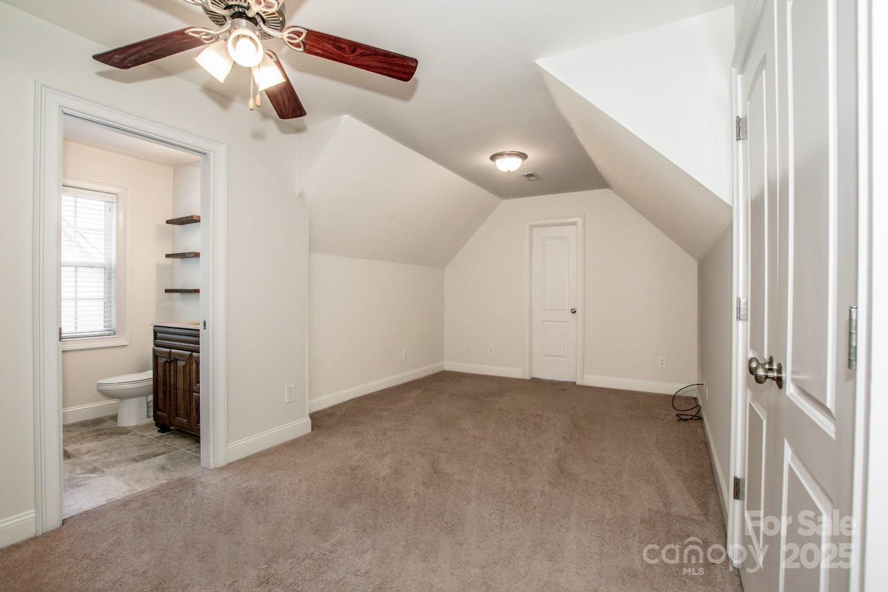 3545 Maple Brook Drive Denver, NC 28037 - Photo 30 of 40 a view of a livingroom with a ceiling fan and window