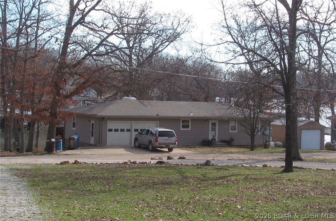 144 Chipmunk Drive Edwards, MO 65326 - Photo 5 of 40 Road-side view of Front of the home. Included, det