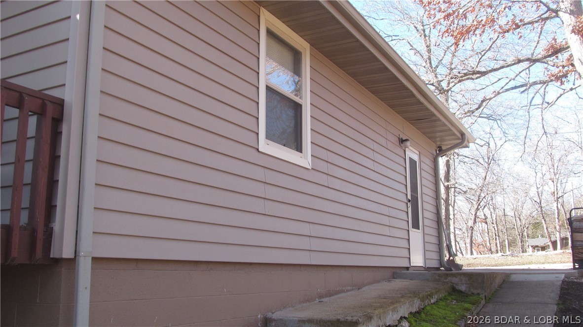 144 Chipmunk Drive Edwards, MO 65326 - Photo 7 of 40 Home has low maintenance, easy-care vinyl siding.