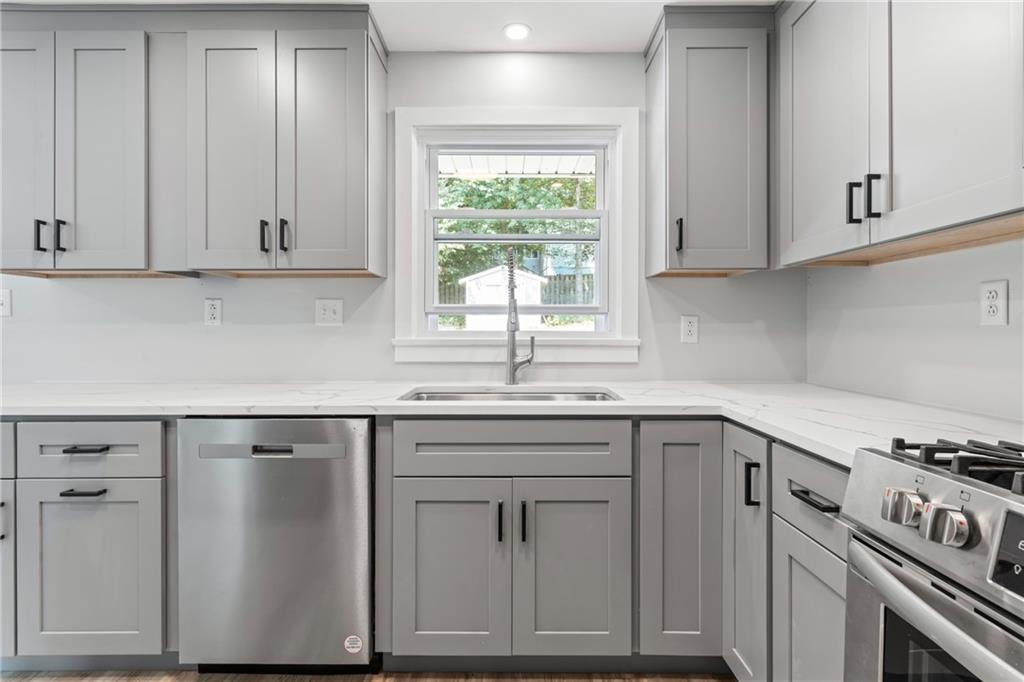 4030 Circle Drive Allison Park, PA 15101 - Photo 16 of 41 a kitchen with granite countertop white cabinets and window