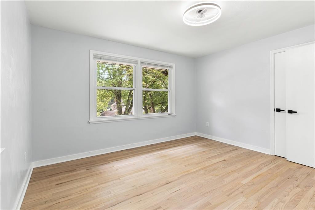 4030 Circle Drive Allison Park, PA 15101 - Photo 19 of 41 an empty room with wooden floor and windows