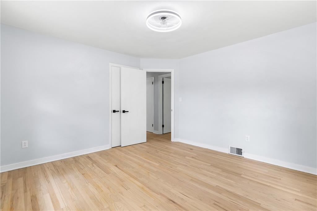 4030 Circle Drive Allison Park, PA 15101 - Photo 20 of 41 an empty room with wooden floor and windows