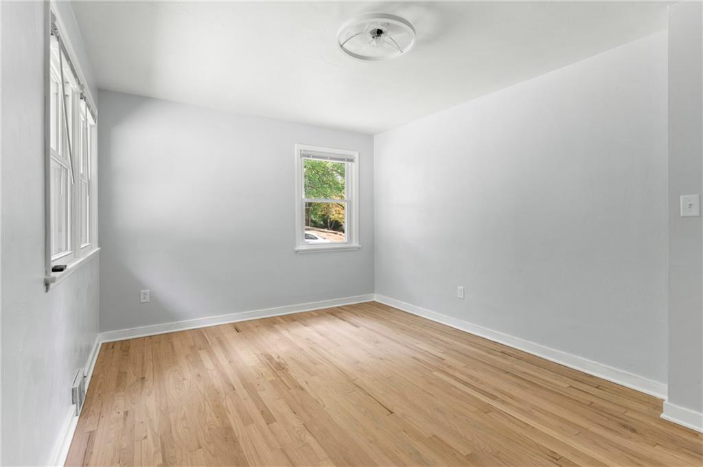 4030 Circle Drive Allison Park, PA 15101 - Photo 23 of 41 an empty room with wooden floor and windows