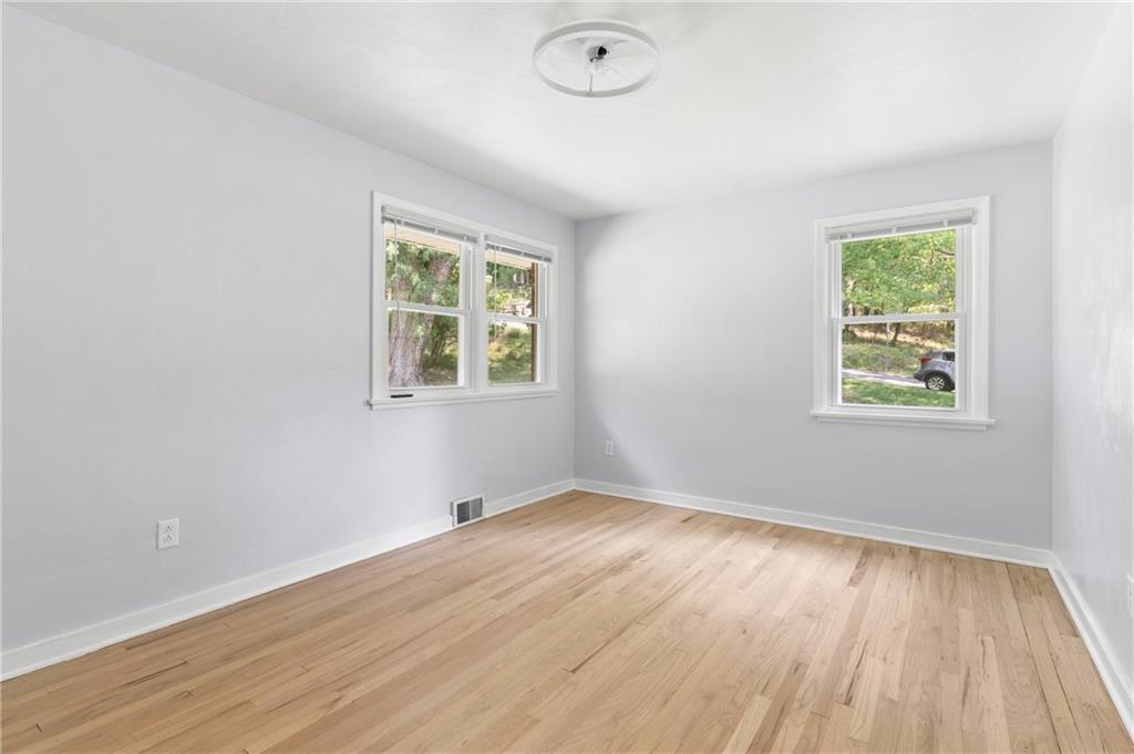 4030 Circle Drive Allison Park, PA 15101 - Photo 25 of 41 an empty room with wooden floor and windows