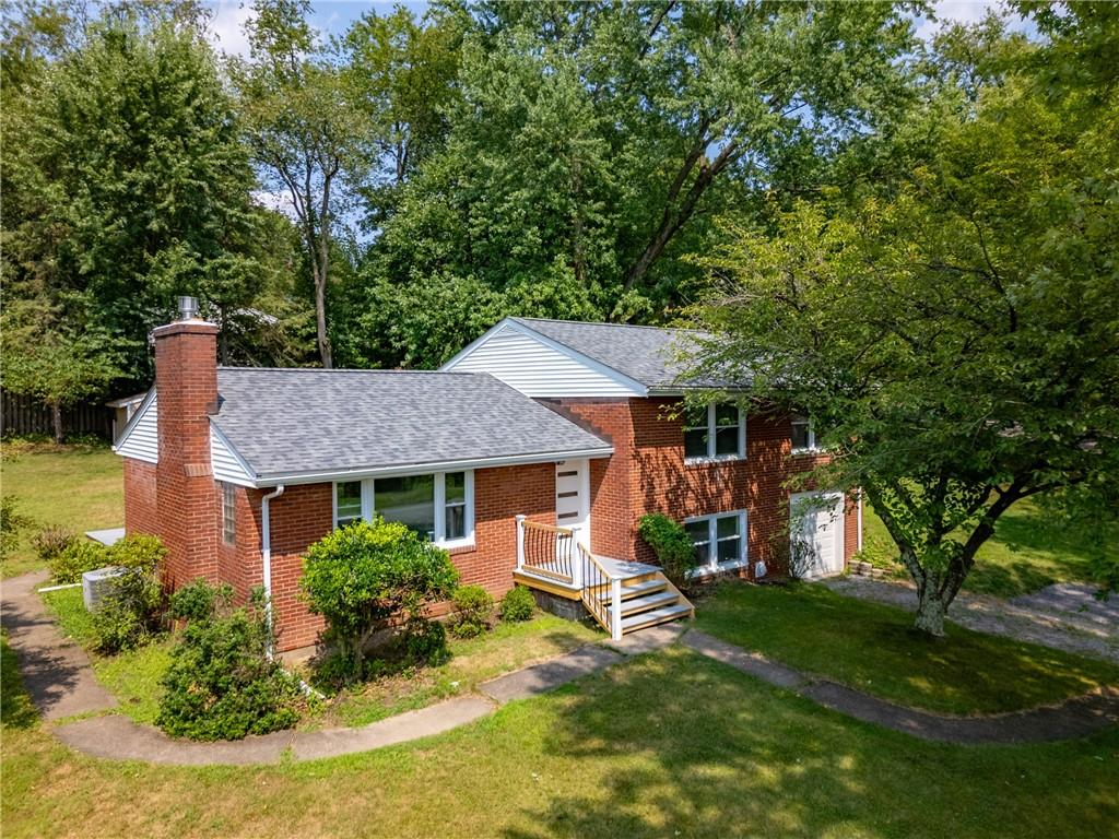 4030 Circle Drive Allison Park, PA 15101 - Photo 35 of 41 a aerial view of a house with a yard table and chairs