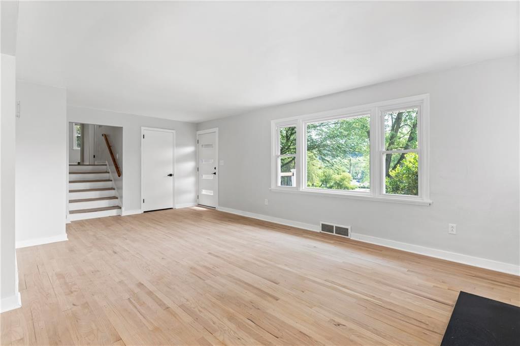 4030 Circle Drive Allison Park, PA 15101 - Photo 4 of 41 an empty room with wooden floor and windows